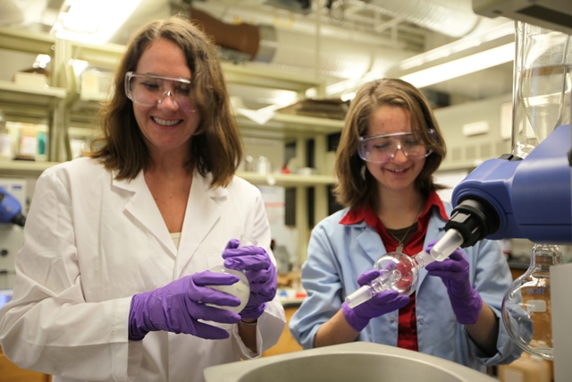 Nina Elliot and Susan Odom work together in Odom's lab.